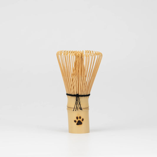Paw-print bamboo mini whisk, whole view on a neutral background.