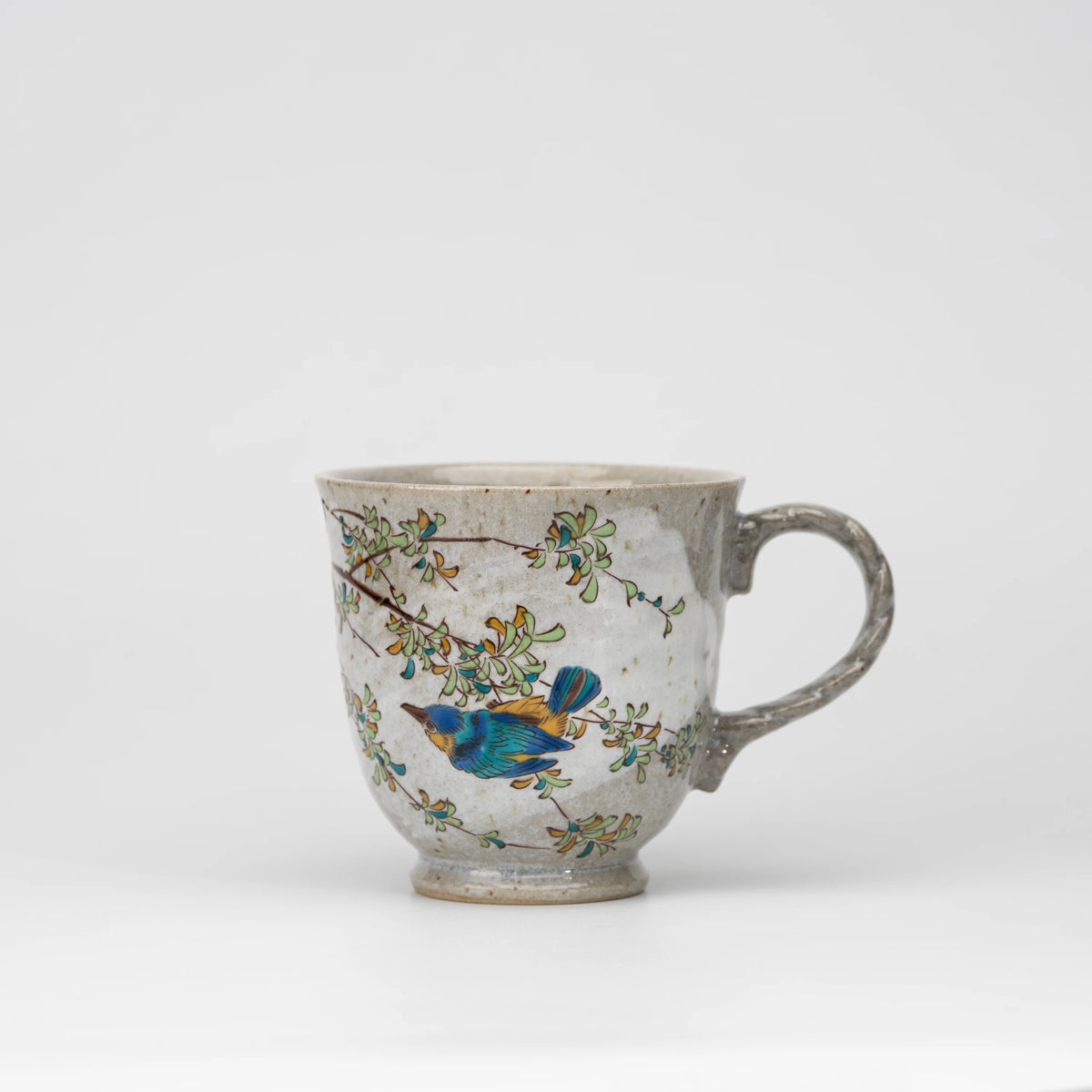 Kingfisher mug, whole view on a neutral background.
