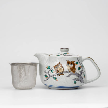 Owl teapot, teapot with the removable mesh strainer beside it.