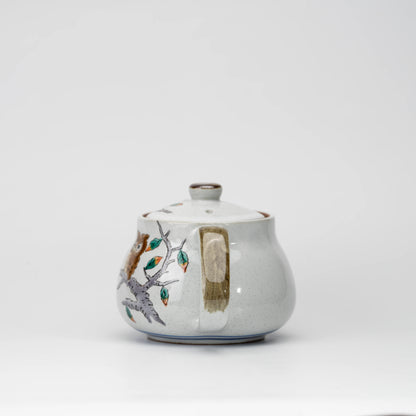 Owl teapot, side view showing the shape and surface.