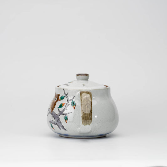 Owl teapot, side view showing the shape and surface.