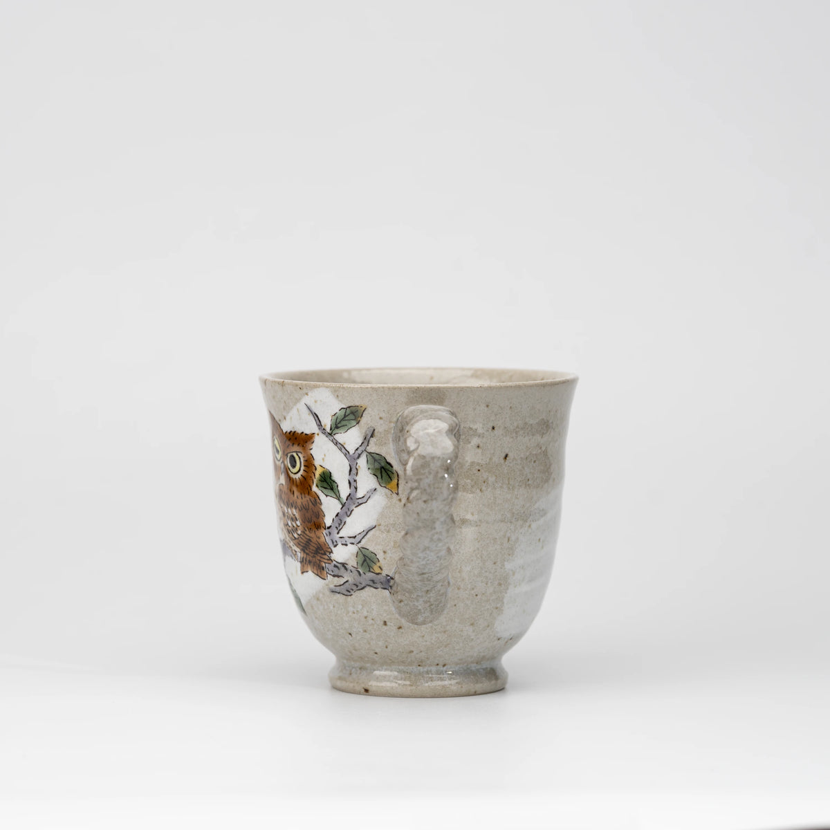 Three owls mug, side view showing the shape and surface.