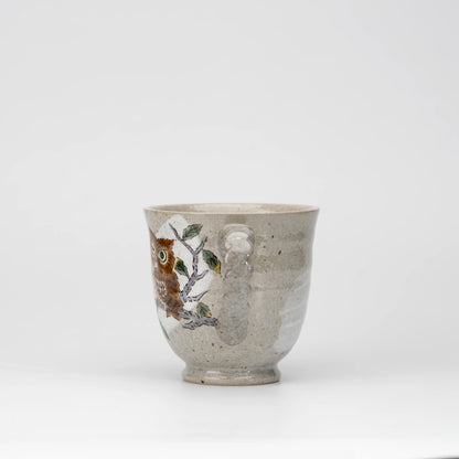 Three owls mug, side view showing the shape and surface.