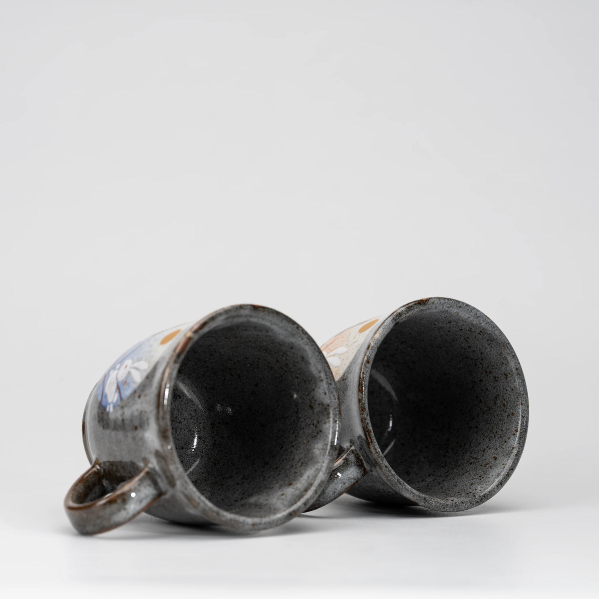 Rabbit and moon mug pair, view from above showing the opening and interior.