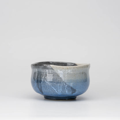 Blue ginsai matcha bowl, side view showing the shape and surface.