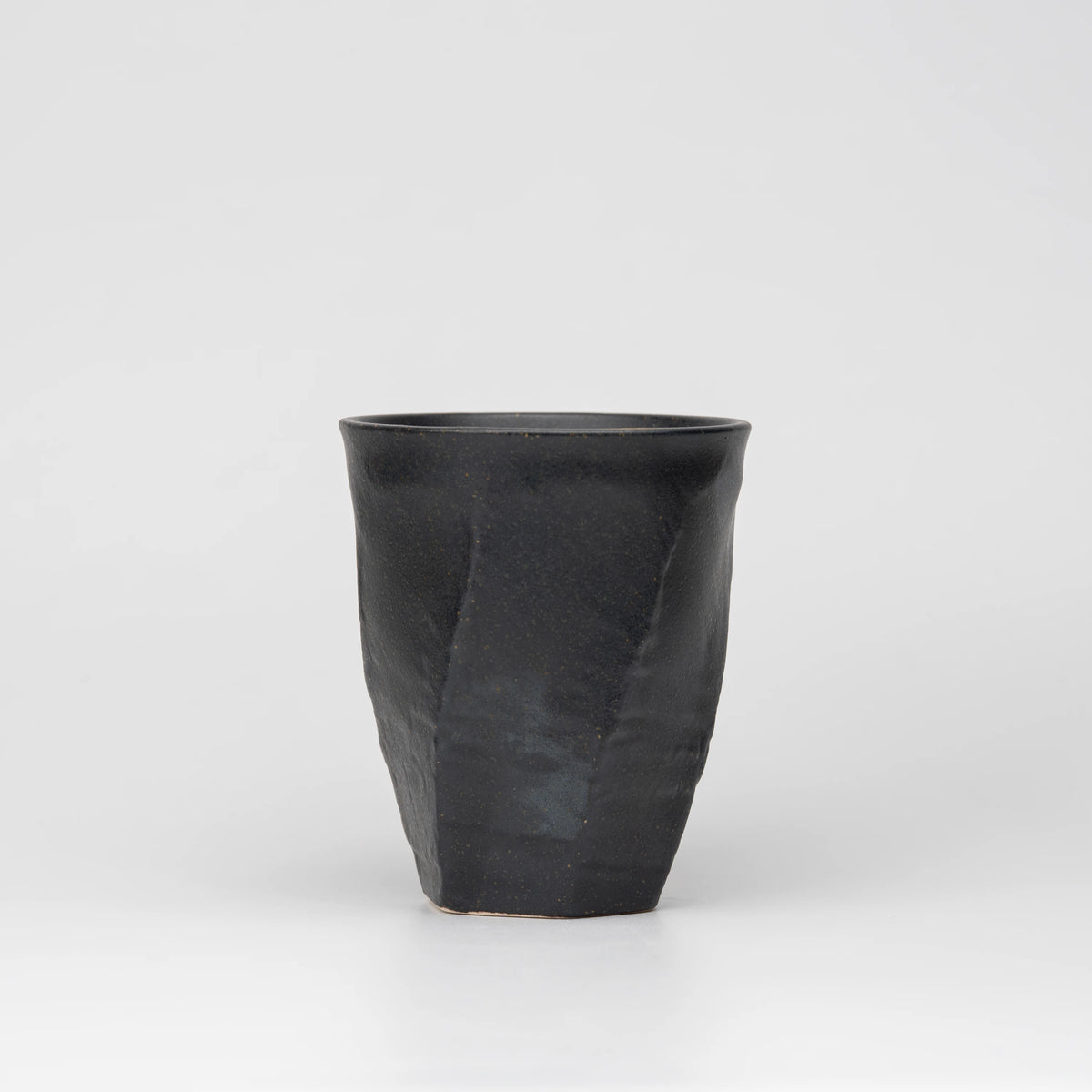 Dark floral medallion cup, reverse view.