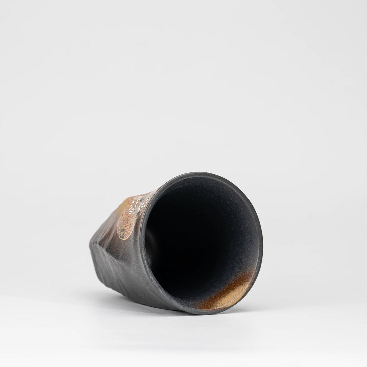 Dark floral medallion cup, view from above showing the opening and interior.