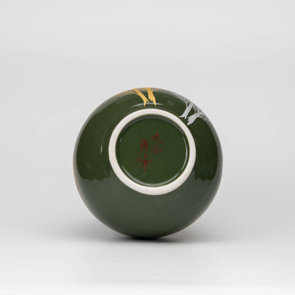 Olive green tree motif bud vase, underside and foot.