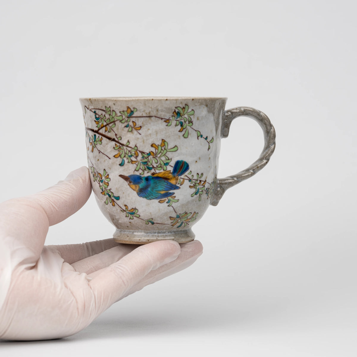 Kingfisher mug, held in a hand to show scale.