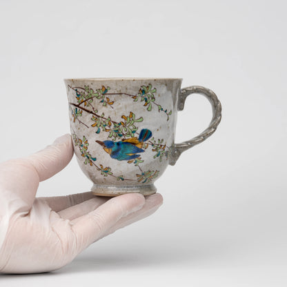 Kingfisher mug, held in a hand to show scale.