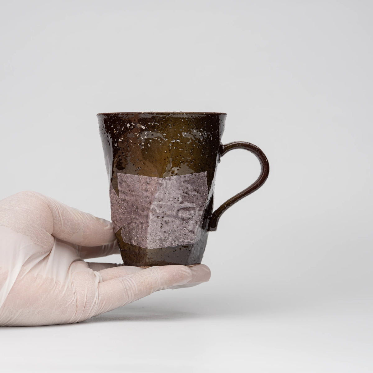 Lilac ginsai mug, held in a hand to show scale.