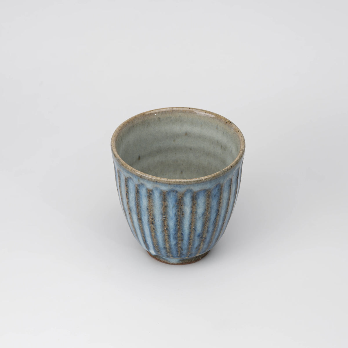 Ribbed blue-grey tea cup, view from above showing the opening and interior.