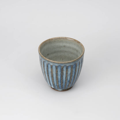 Ribbed blue-grey tea cup, view from above showing the opening and interior.