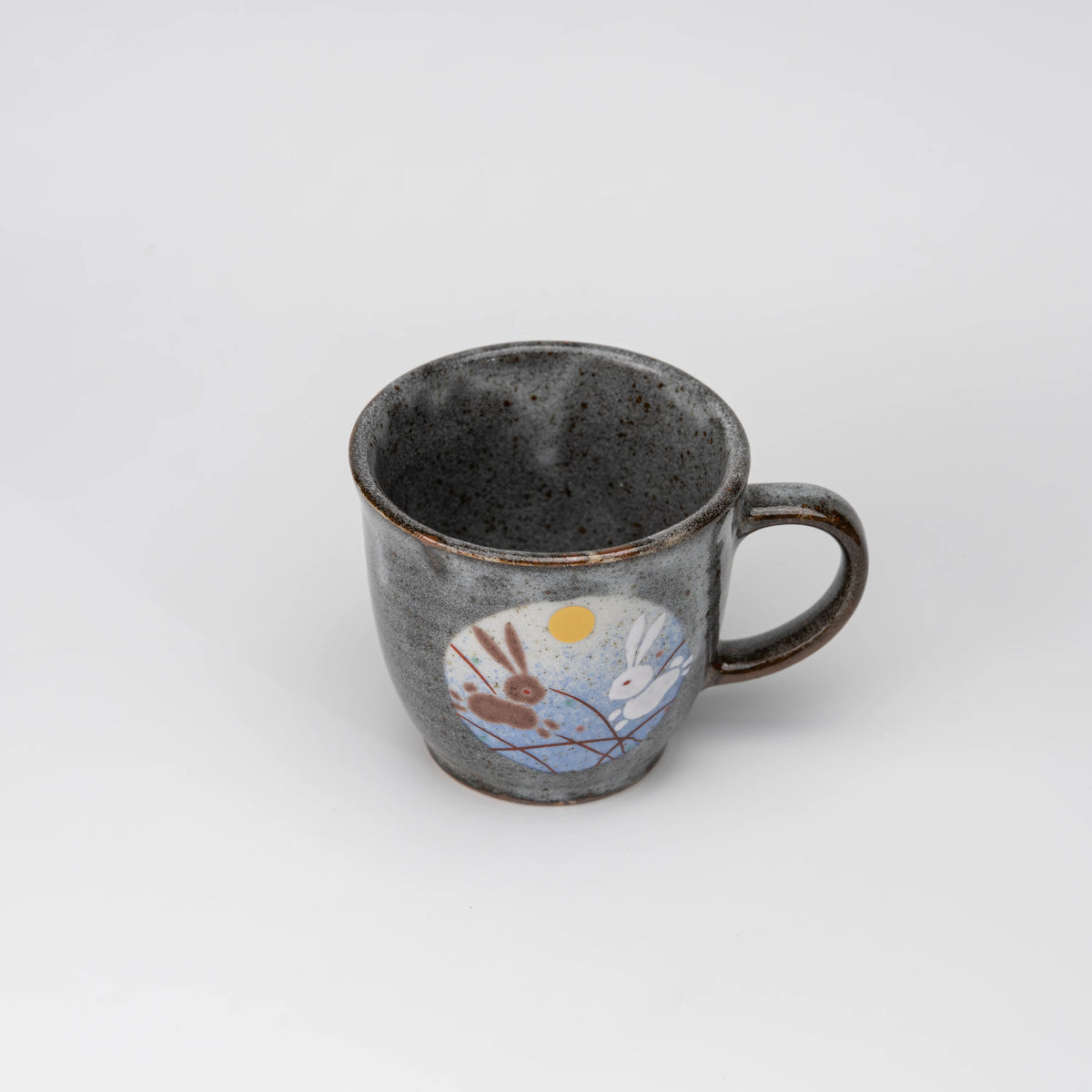Rabbit motif mug, view from above showing the opening and interior.