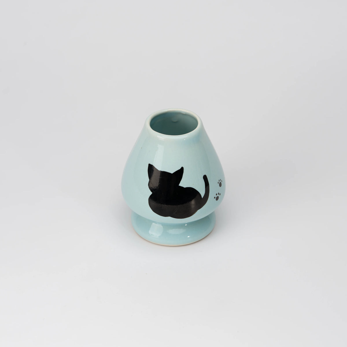Pale blue cat whisk holder, view from above showing the opening and interior.