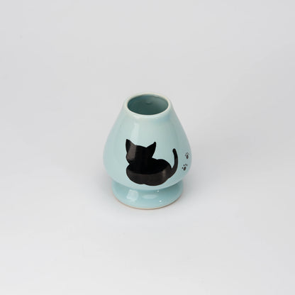 Pale blue cat whisk holder, view from above showing the opening and interior.