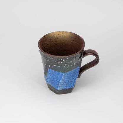 Blue ginsai mug, side view showing the shape and surface.