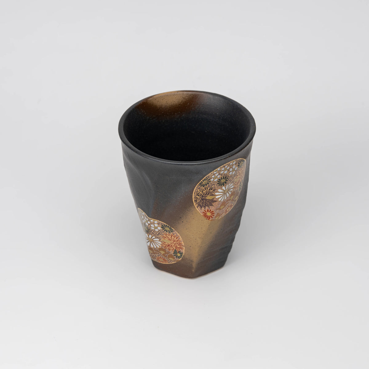 Dark floral medallion cup, view from above showing the opening and interior.