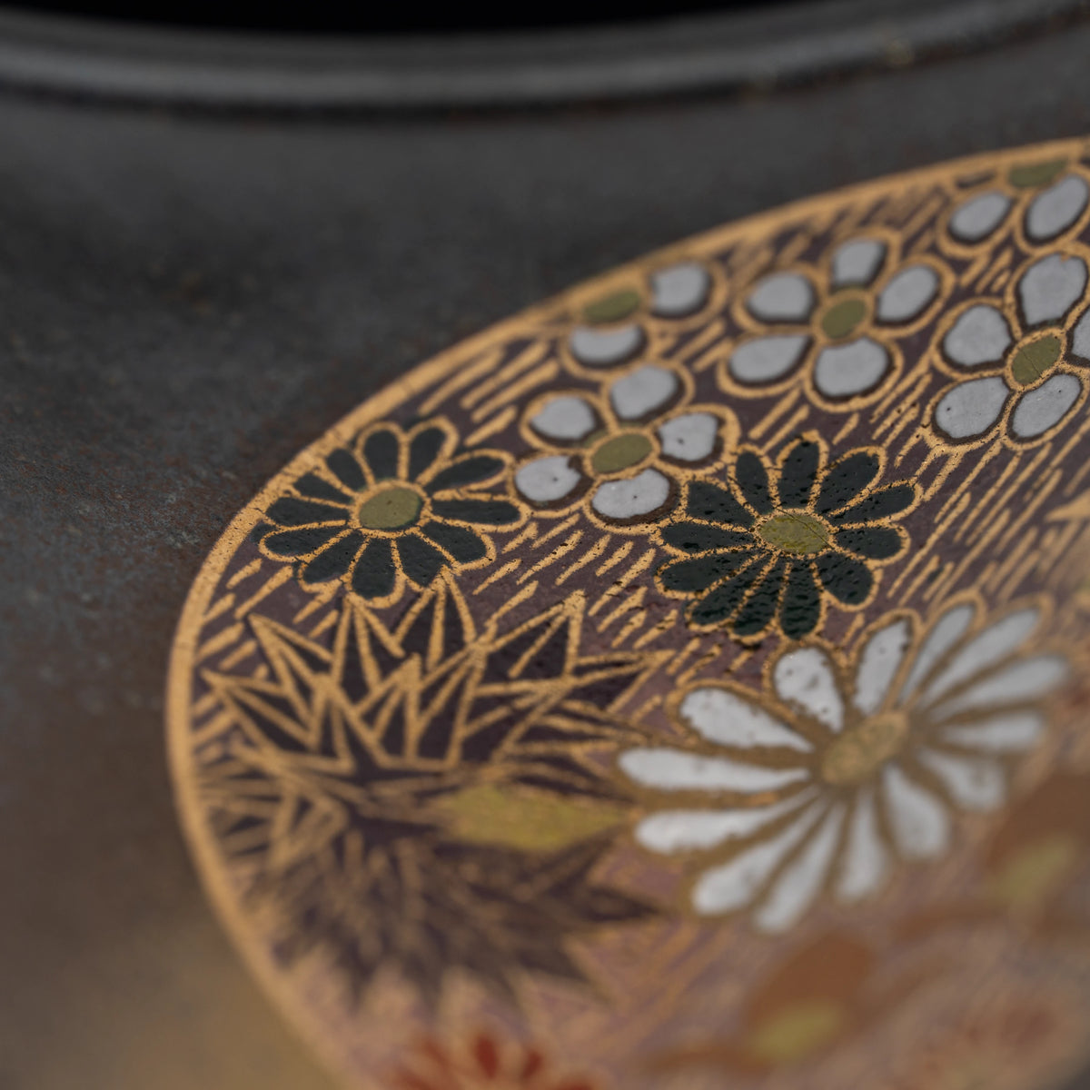 Dark floral medallion cup, floral medallion detail.