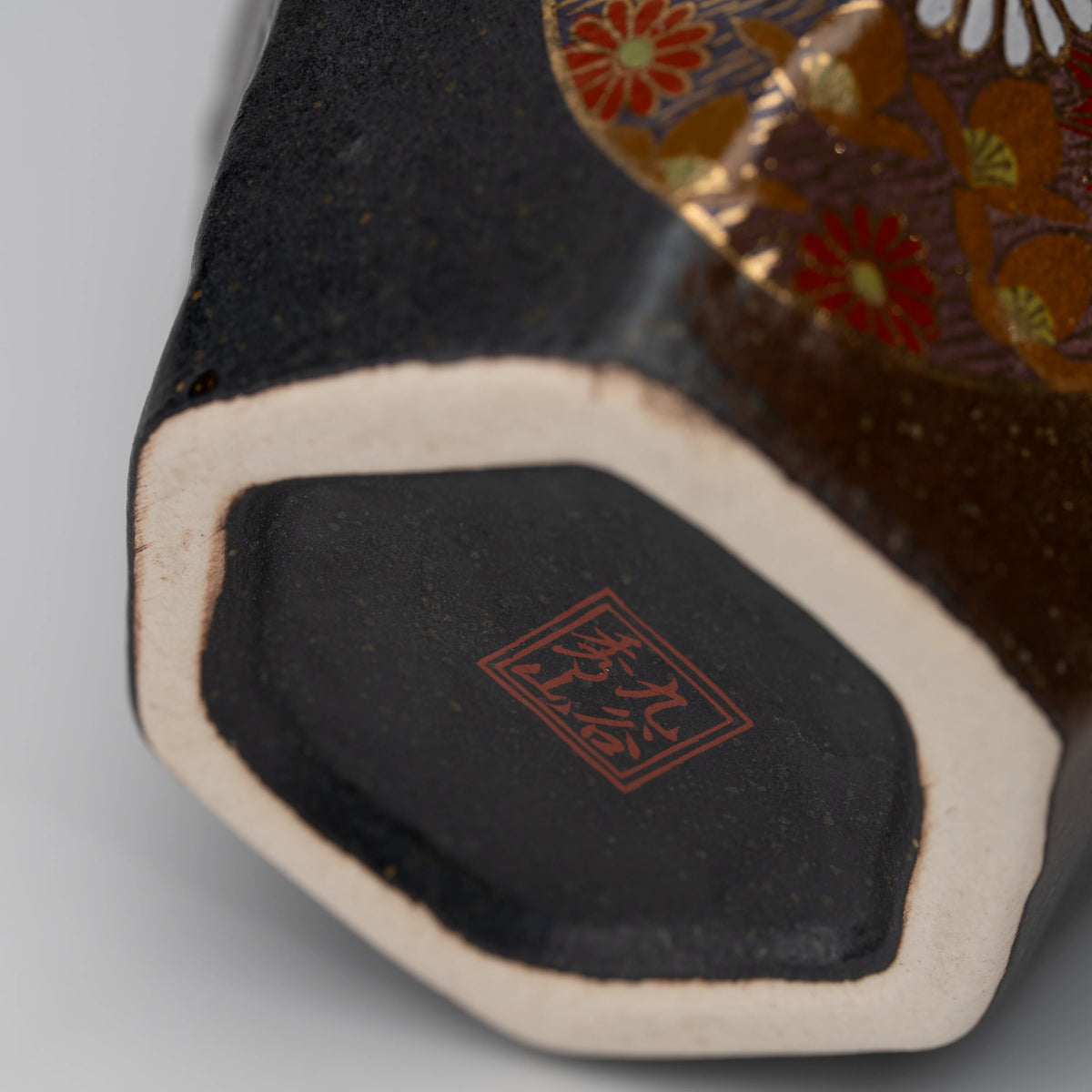 Dark floral medallion cup, underside and foot.