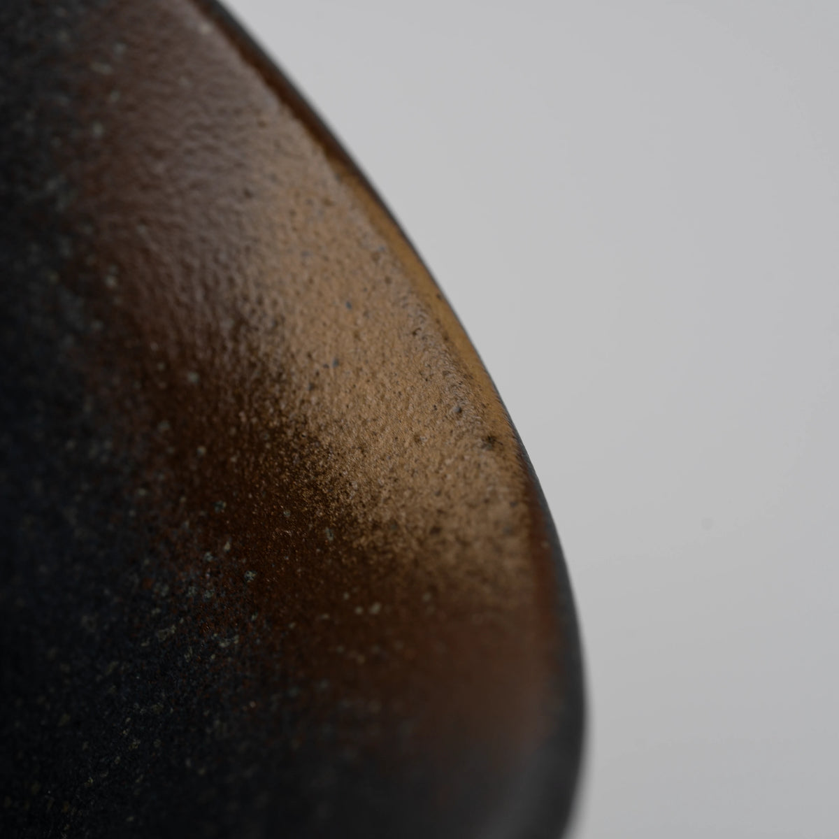 Dark floral medallion cup, rim and interior detail.