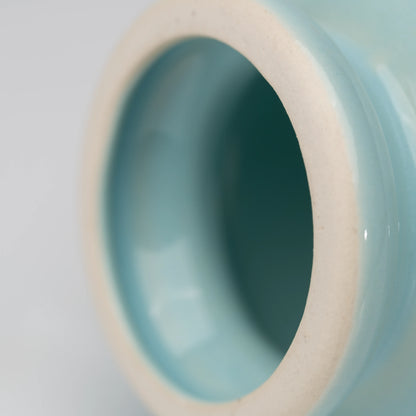 Pale blue cat whisk holder, open ceramic ring.