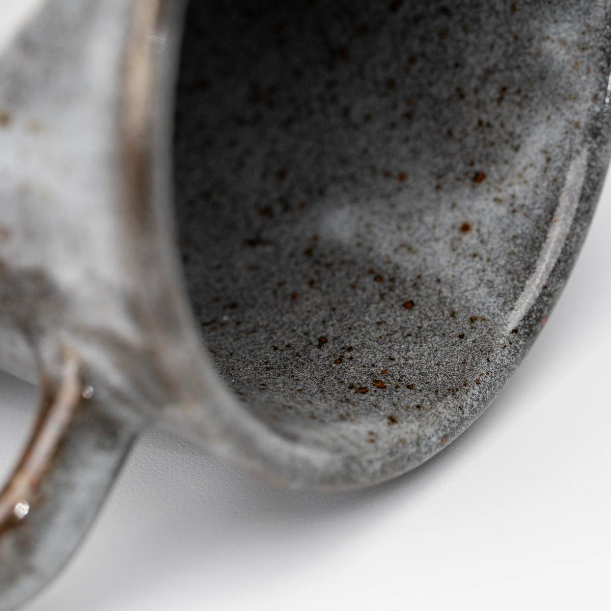 Rabbit motif mug, rim and interior detail.