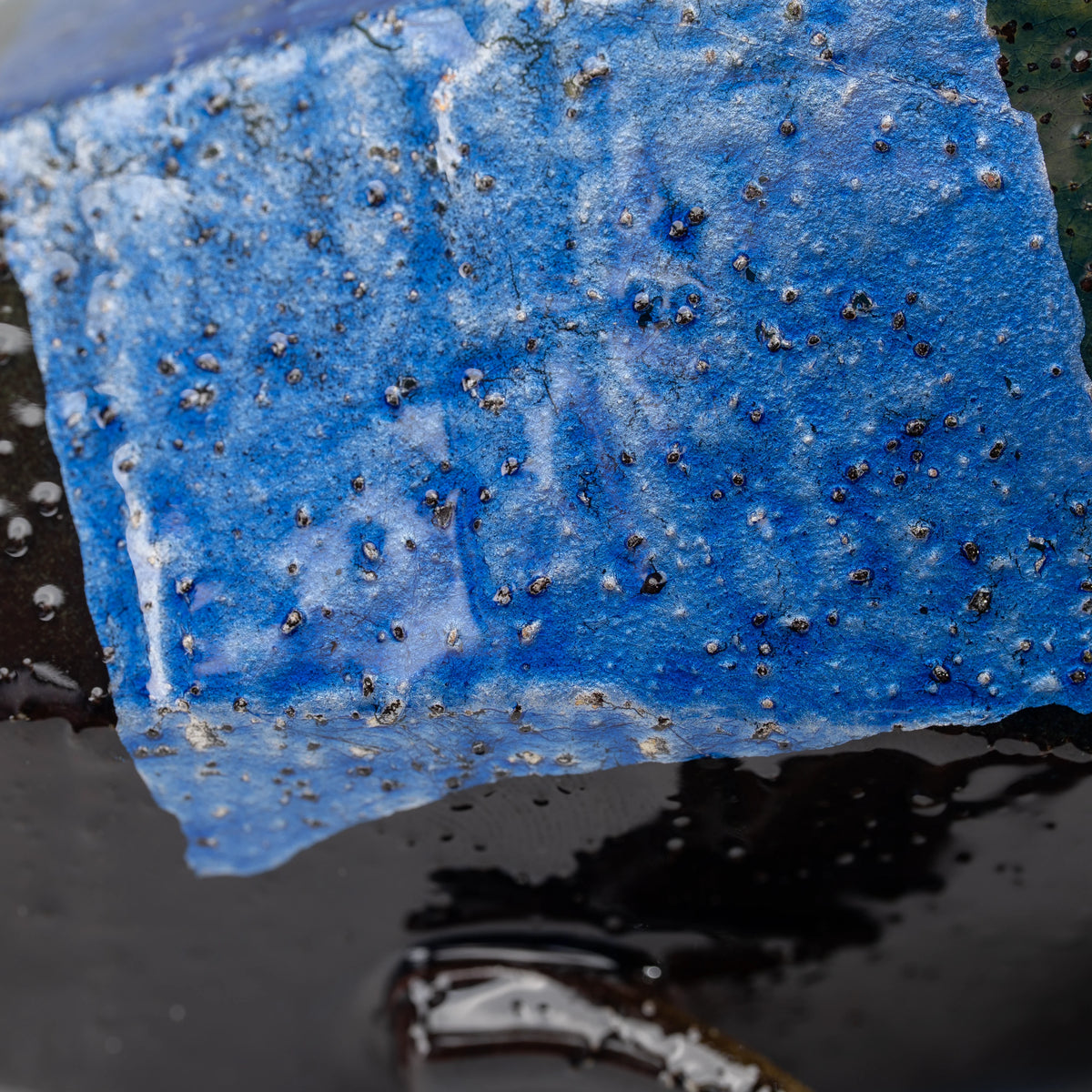 Blue ginsai mug, foil panel and glazed surface detail.