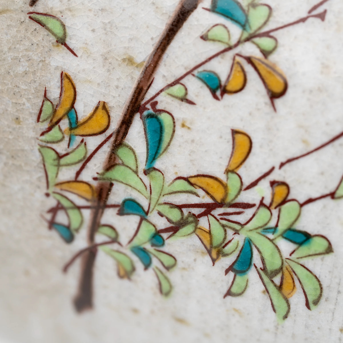Kingfisher mug, leaf and branch decoration.
