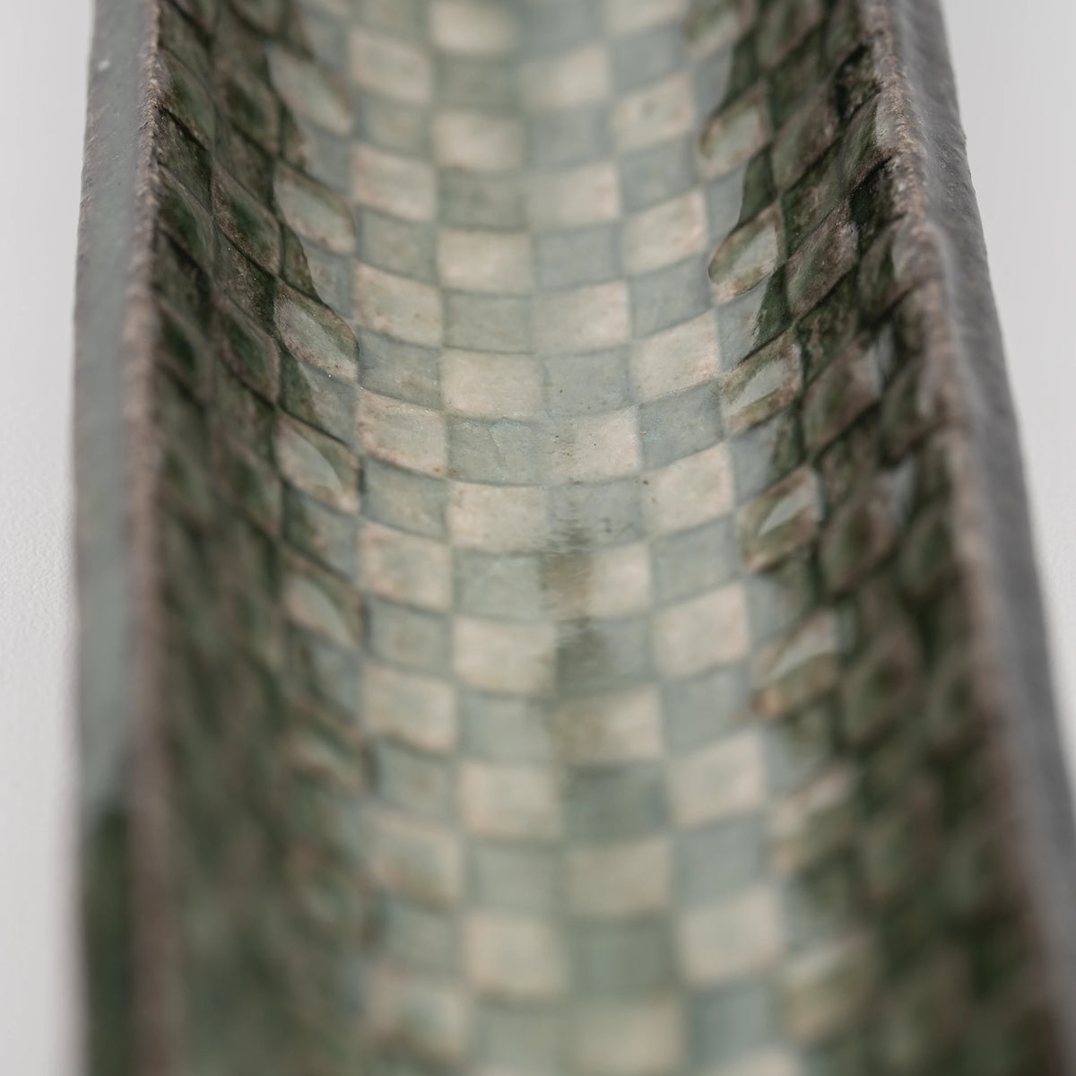 Green mosaic incense holder, green and cream checker detail.