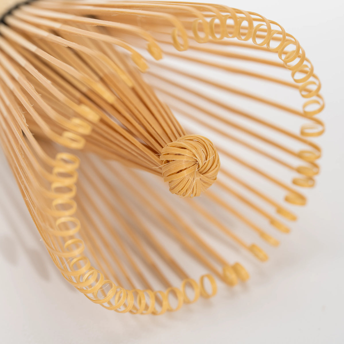 Paw-print bamboo mini whisk, fine bamboo tines.