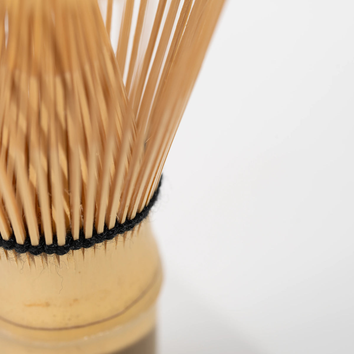 Paw-print bamboo mini whisk, fine bamboo tines.