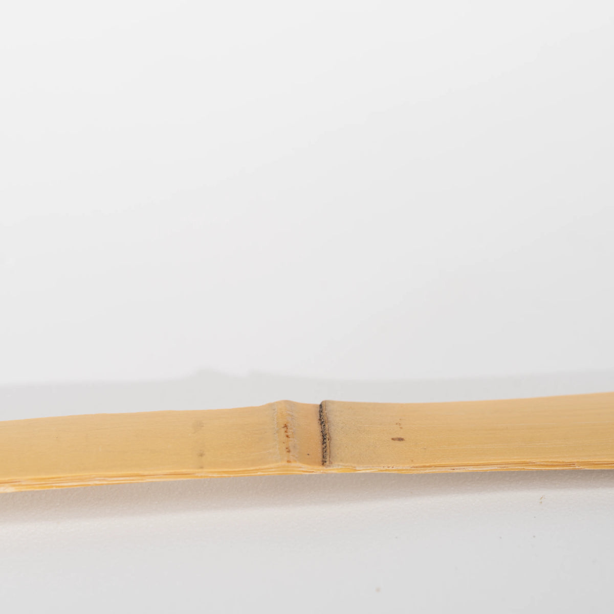 Paw-print bamboo matcha scoop, bamboo node along the handle.