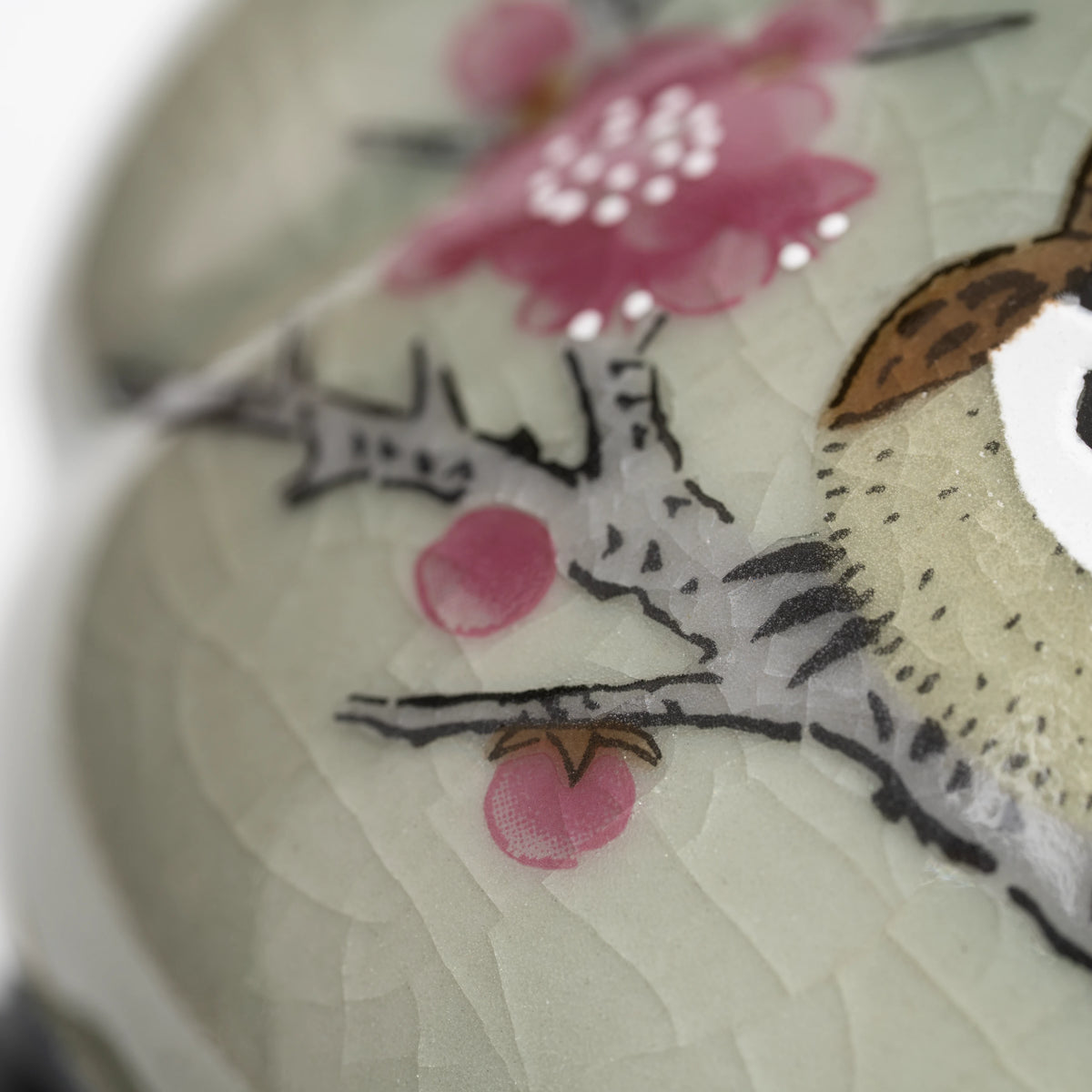 Sparrow teapot, pink blossom decoration.