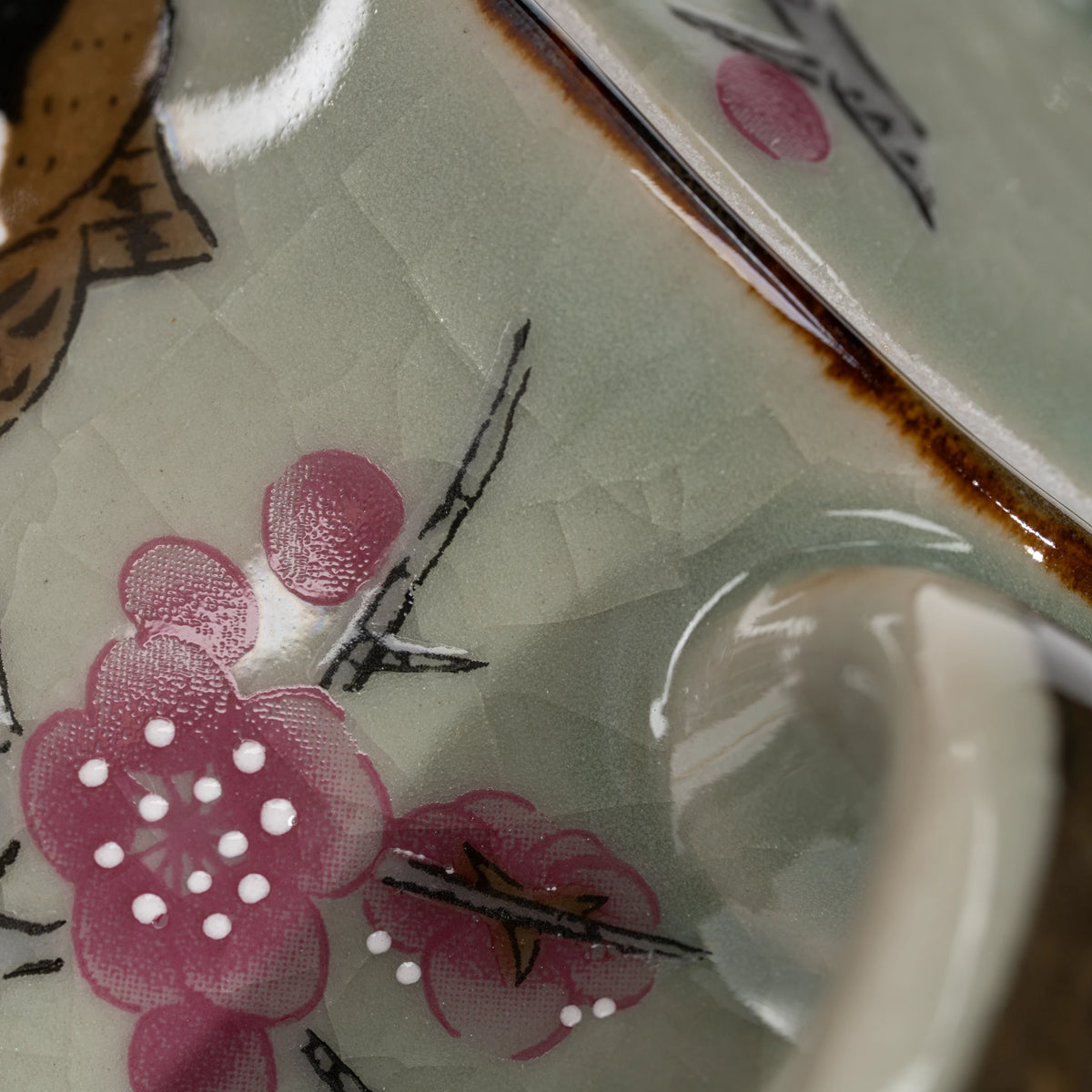 Sparrow teapot, pink blossom decoration.