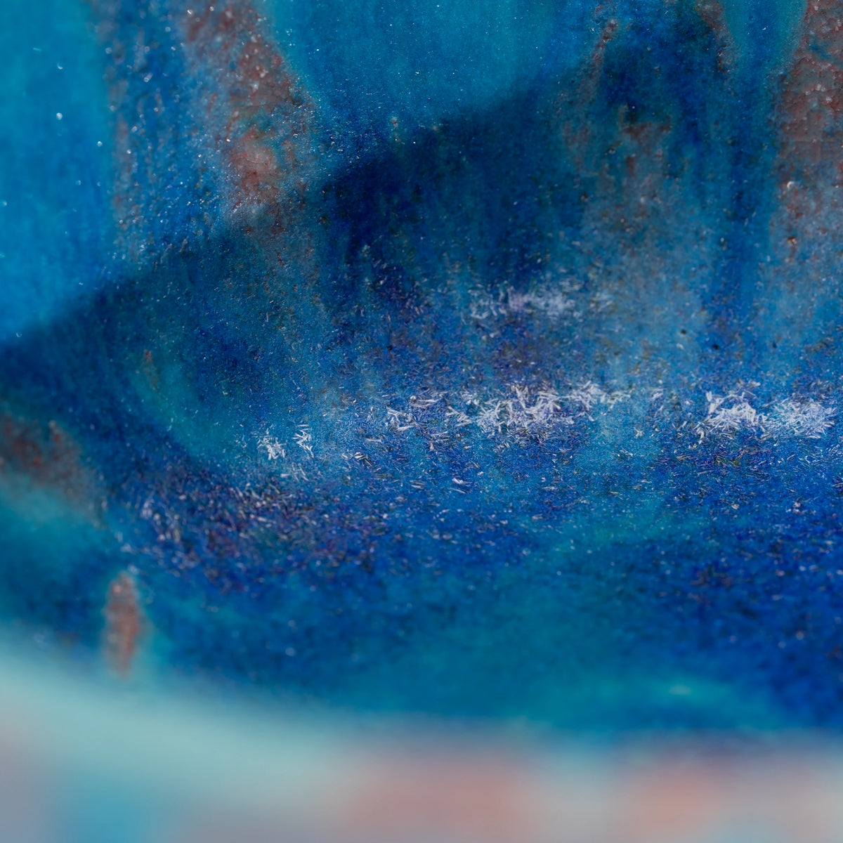 Blue Tsuyukusa matcha bowl, blue glaze and purple-brown band detail.