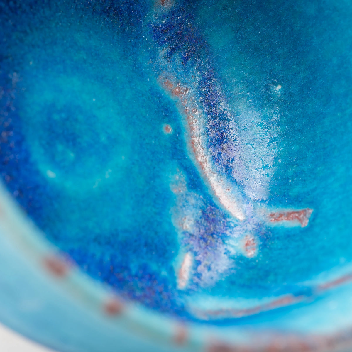 Blue Tsuyukusa matcha bowl, blue glaze and purple-brown band detail.