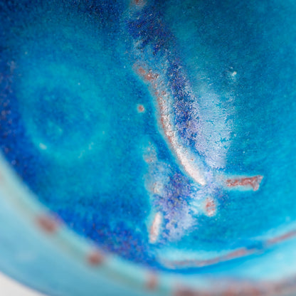 Blue Tsuyukusa matcha bowl, blue glaze and purple-brown band detail.