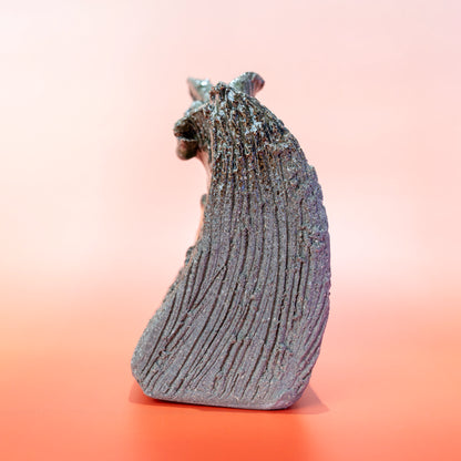 Side profile of a Shigaraki ware bud vase with an organic curved silhouette