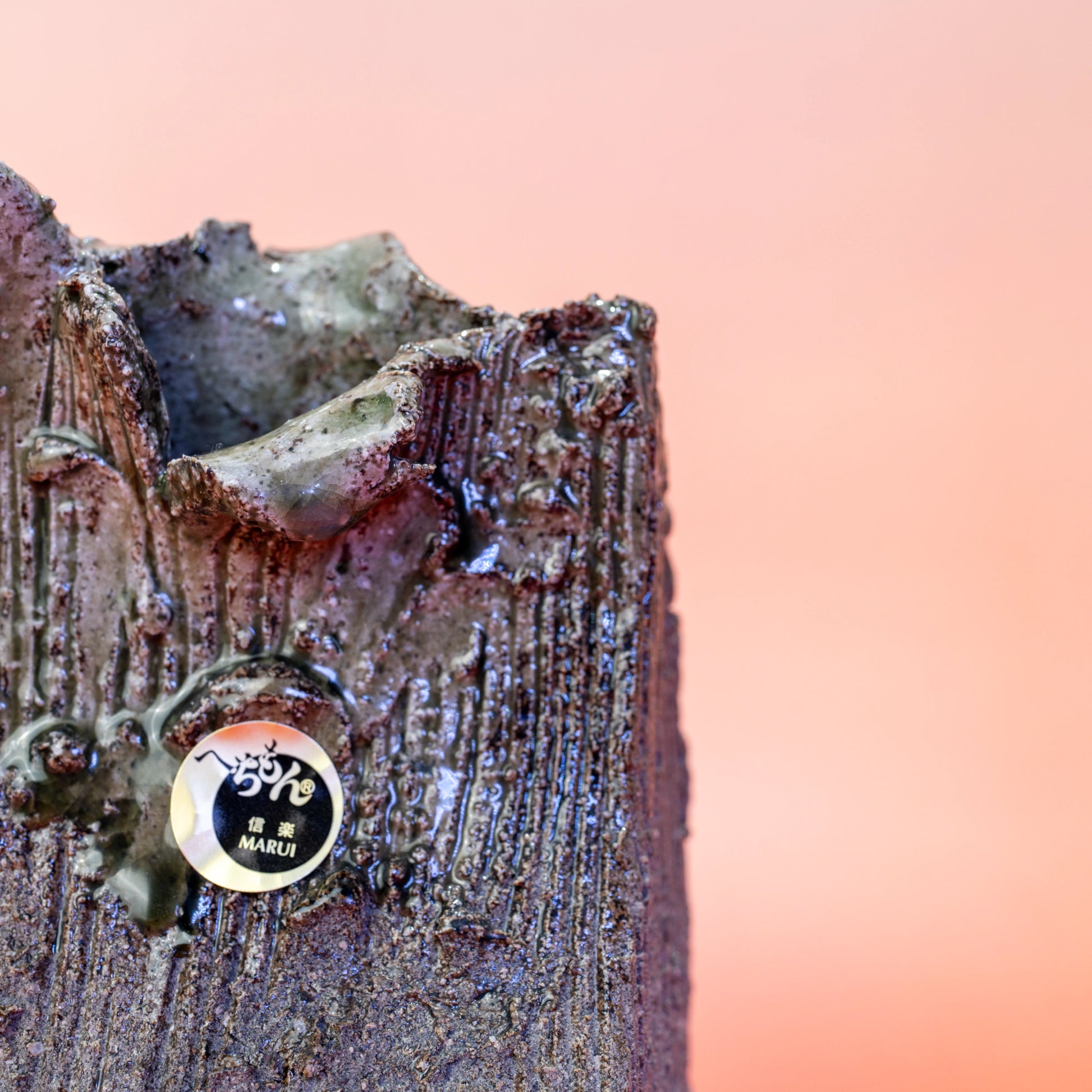 Close-up of the textured surface and opening of a Shigaraki ware bud vase