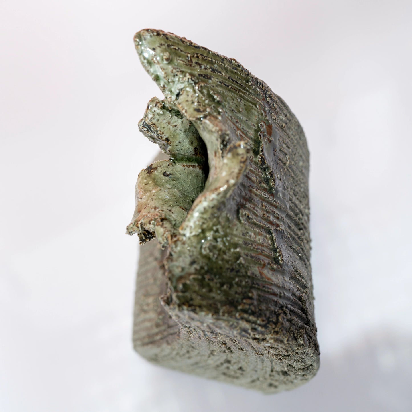Opposite side view of a Shigaraki ware bud vase with an asymmetrical sculptural form