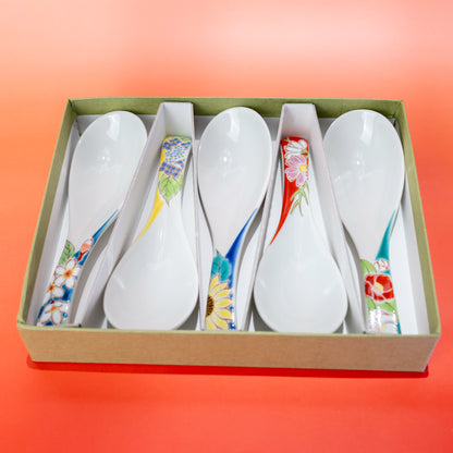 Top view of a Kutani porcelain spoon set of 5 presented in an open gift box