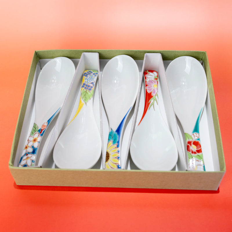Top view of a Kutani porcelain spoon set of 5 presented in an open gift box