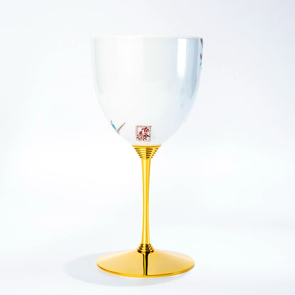 Single Kutani porcelain wine cup standing upright on a gold stem against a white background