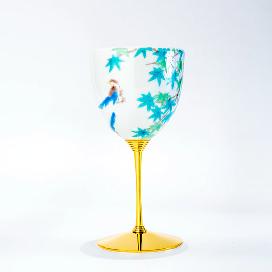 Single Kutani wine cup with blue bird and maple leaf motif on a gold stem