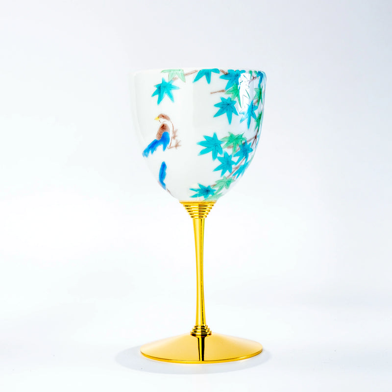 Single Kutani wine cup with blue bird and maple leaf motif on a gold stem