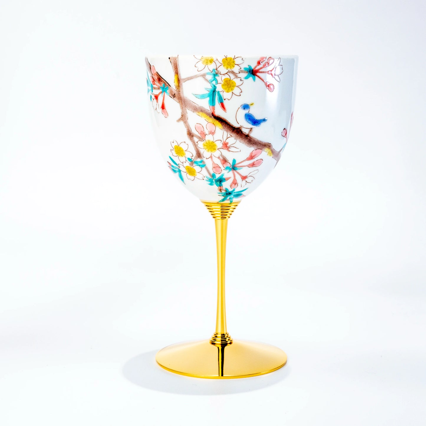 Single Kutani wine cup with bird and flowering branch motif on a gold stem