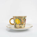 Taza y platillo Kutani con decoración floral dorada