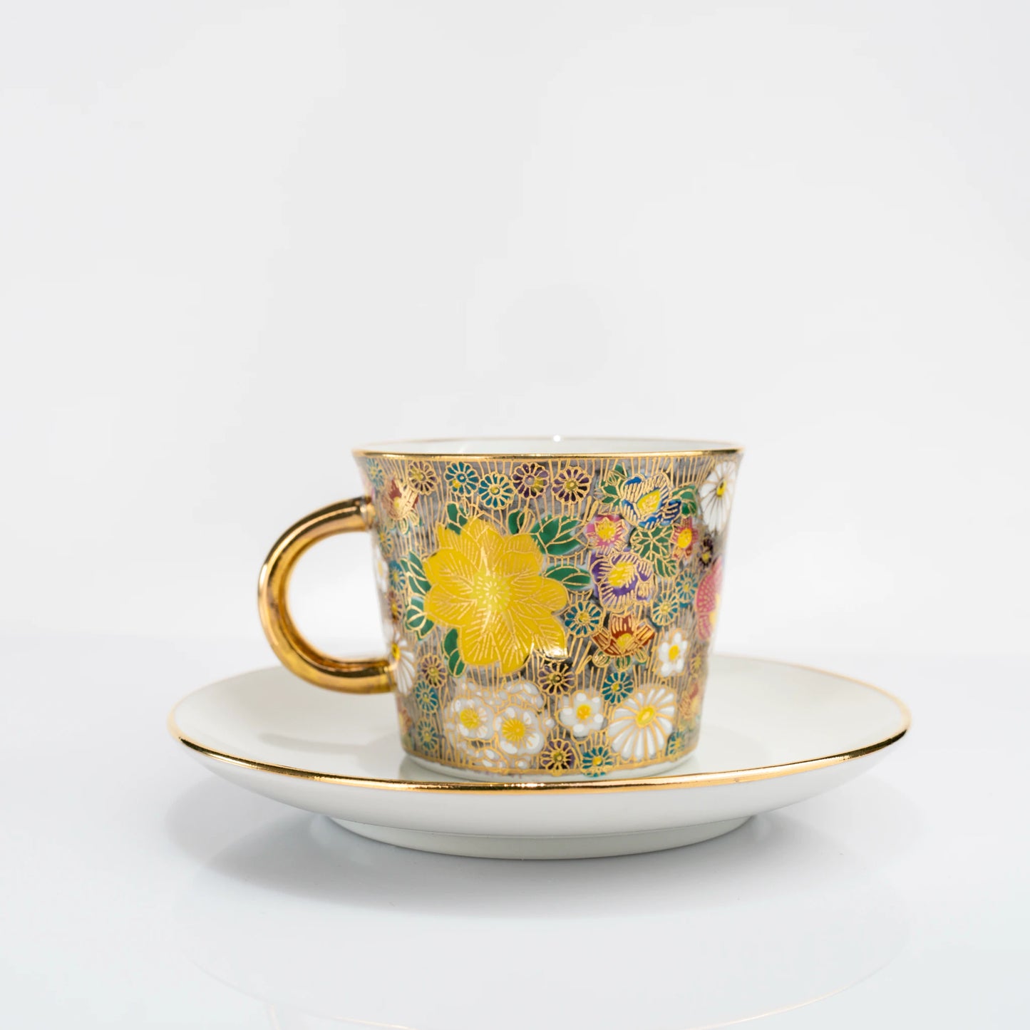 Kutani gold floral cup and saucer set front view on white background
