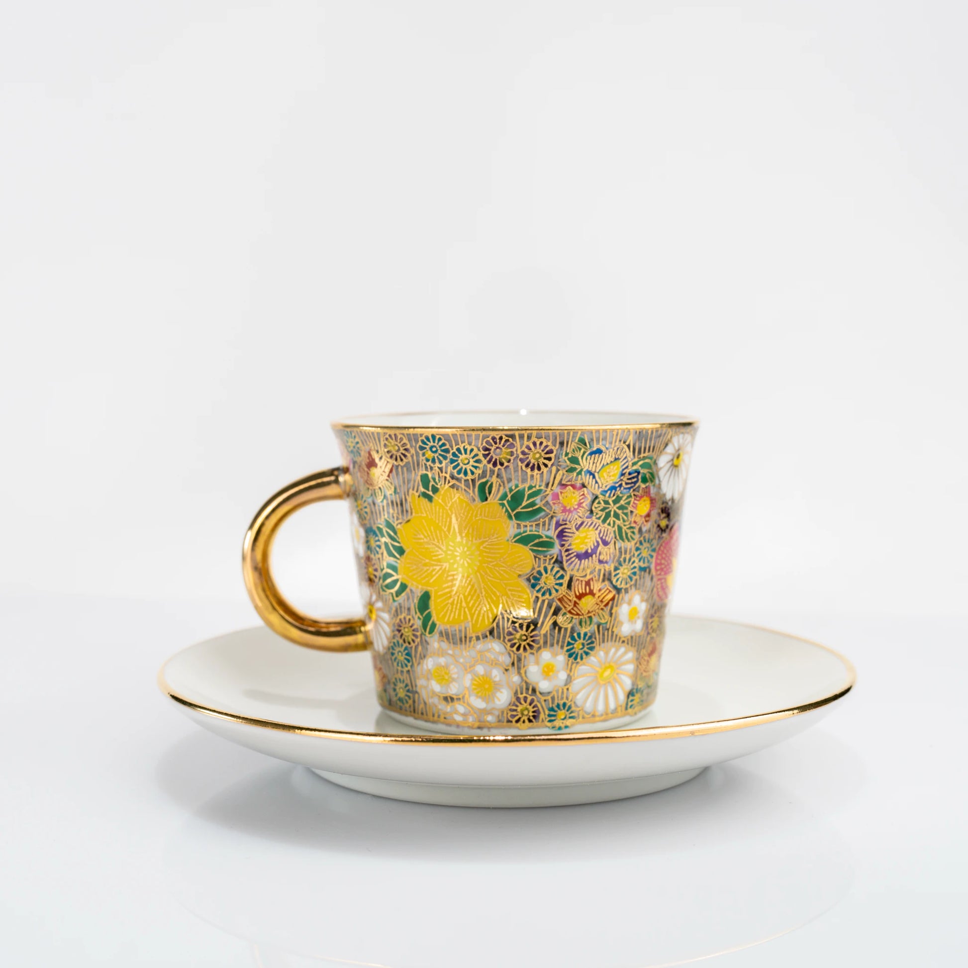 Kutani gold floral cup and saucer set front view on white background